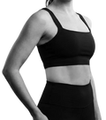 Model wearing has-bind bra alternative in black